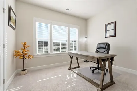 a workspace with furniture and a window