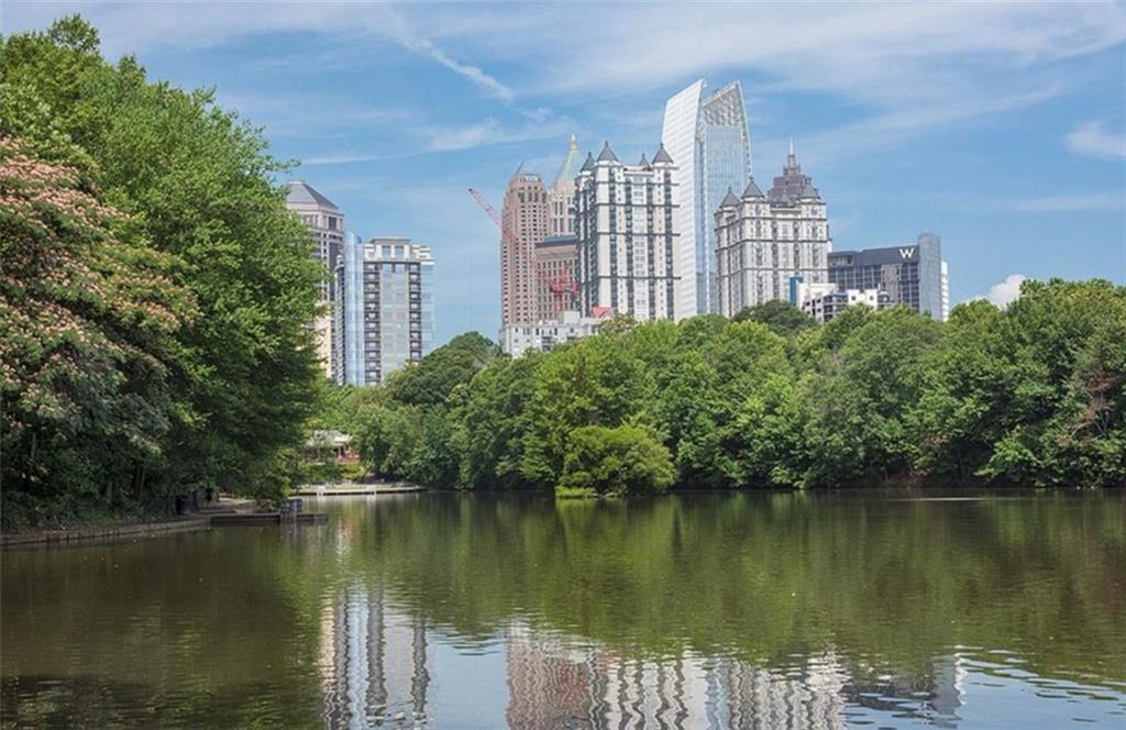 199 14th Street Northeast, Unit 201 Atlanta, GA 30309 - Photo 2 of 42 a view of a lake with building in front of lake