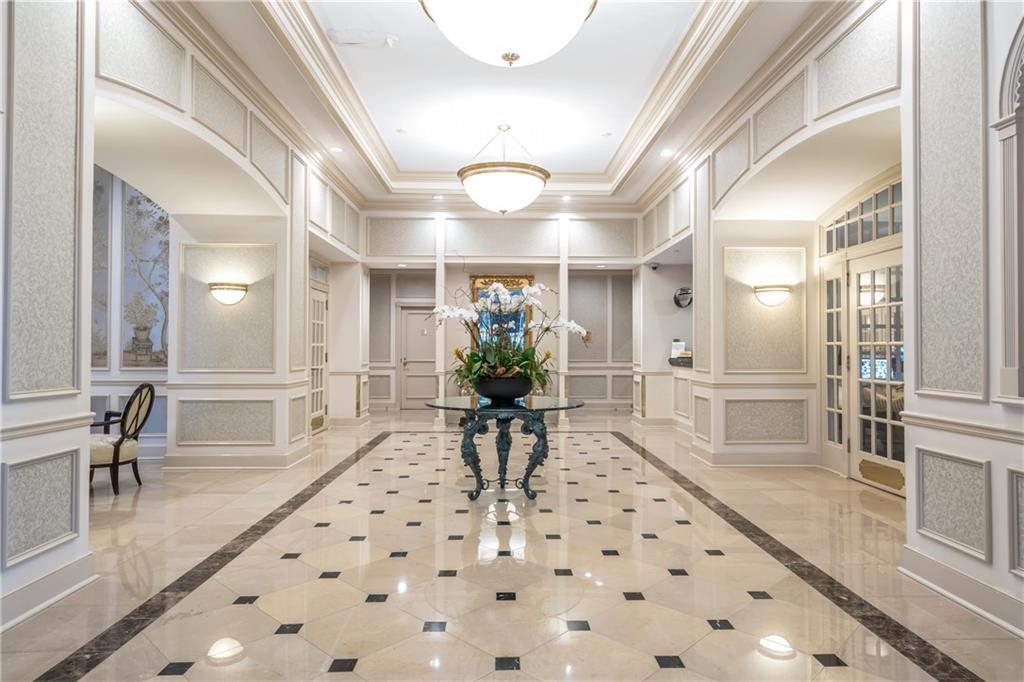 199 14th Street Northeast, Unit 201 Atlanta, GA 30309 - Photo 26 of 42 a lobby with furniture and a potted plant