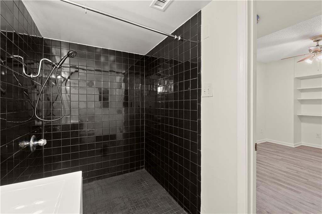 199 14th Street Northeast, Unit 201 Atlanta, GA 30309 - Photo 29 of 42 a bathroom with a shower