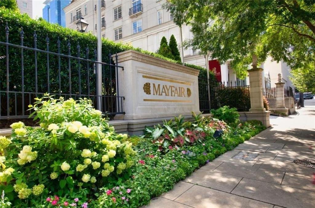 199 14th Street Northeast, Unit 201 Atlanta, GA 30309 - Photo 41 of 42 a sign that is sitting in front of flowers