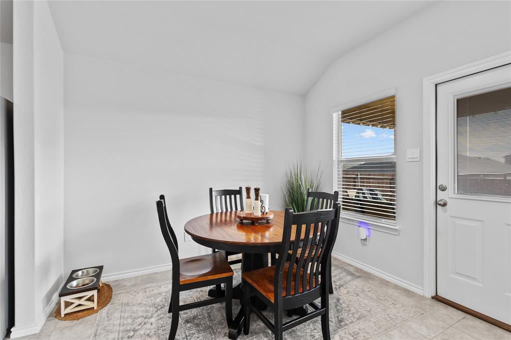 613 Whitecomb Lane Justin, TX 76247 - Photo 11 of 29 a view of a dining room with furniture and wooden floor