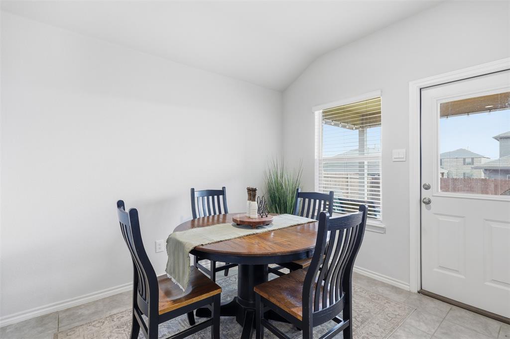 613 Whitecomb Lane Justin, TX 76247 - Photo 12 of 39 a view of a dining room with furniture and a window