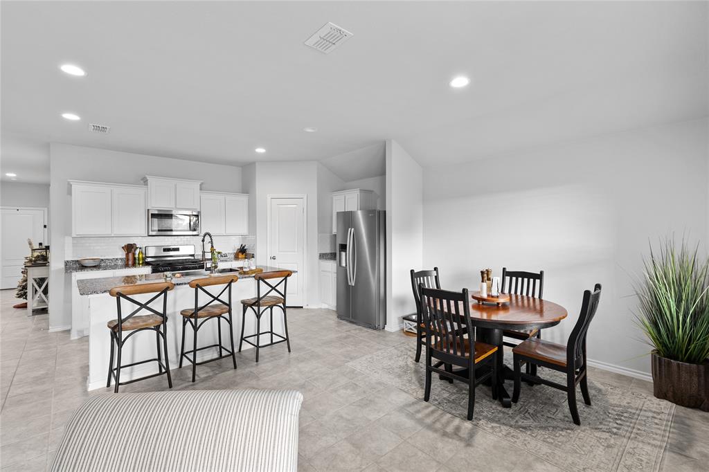 613 Whitecomb Lane Justin, TX 76247 - Photo 12 of 29 a view of a dining room with furniture