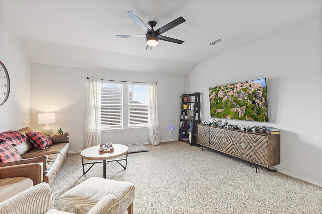 613 Whitecomb Lane Justin, TX 76247 - Photo 13 of 29 a living room with furniture and a large window