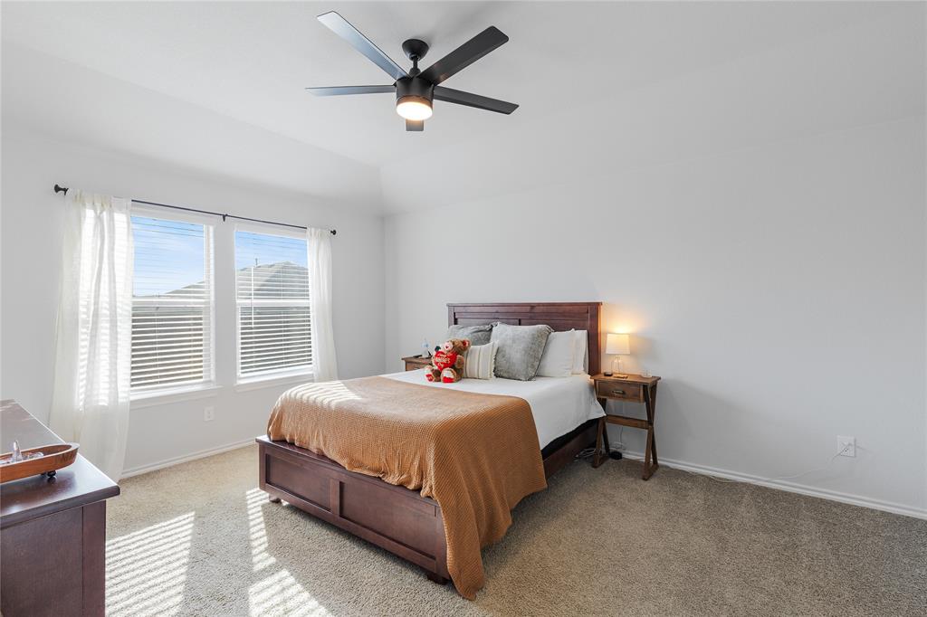 613 Whitecomb Lane Justin, TX 76247 - Photo 15 of 29 a bedroom with a bed and a large window