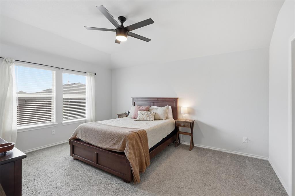 613 Whitecomb Lane Justin, TX 76247 - Photo 18 of 39 a bedroom with a bed and a window