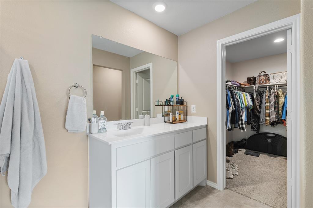 613 Whitecomb Lane Justin, TX 76247 - Photo 20 of 29 a bathroom with a sink vanity and mirror