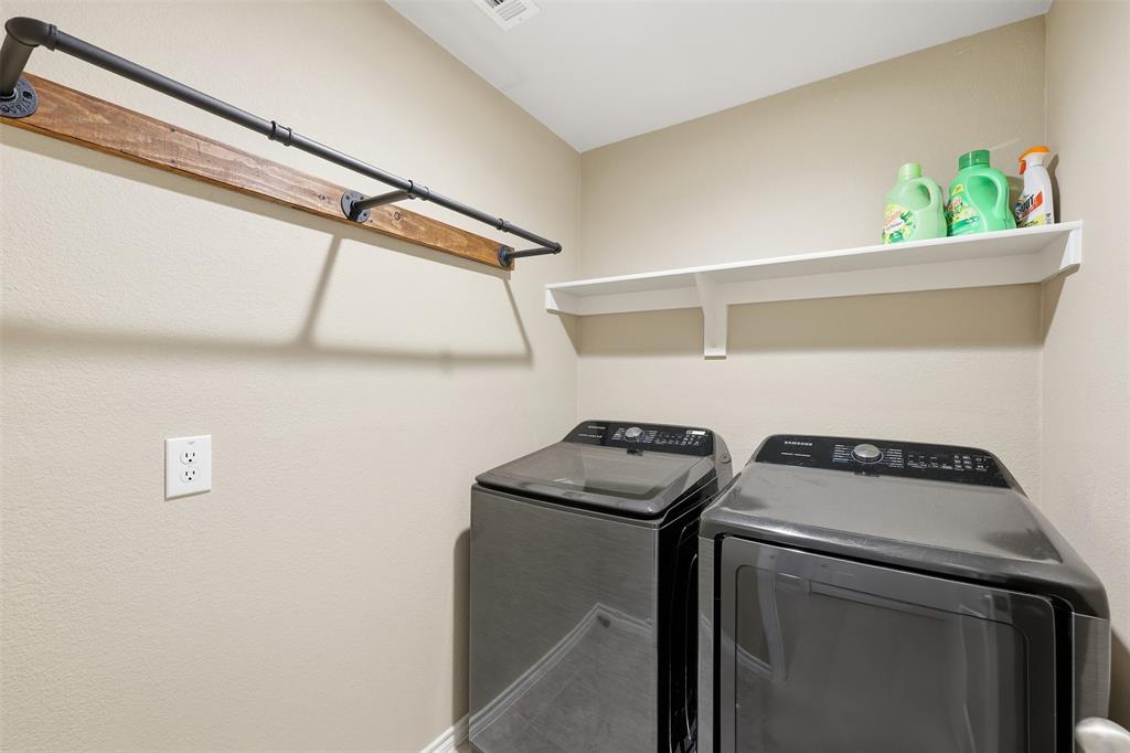 613 Whitecomb Lane Justin, TX 76247 - Photo 24 of 39 a utility room with dryer and washer