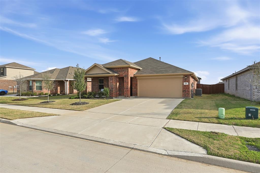 613 Whitecomb Lane Justin, TX 76247 - Photo 25 of 39 front view of a house with a yard