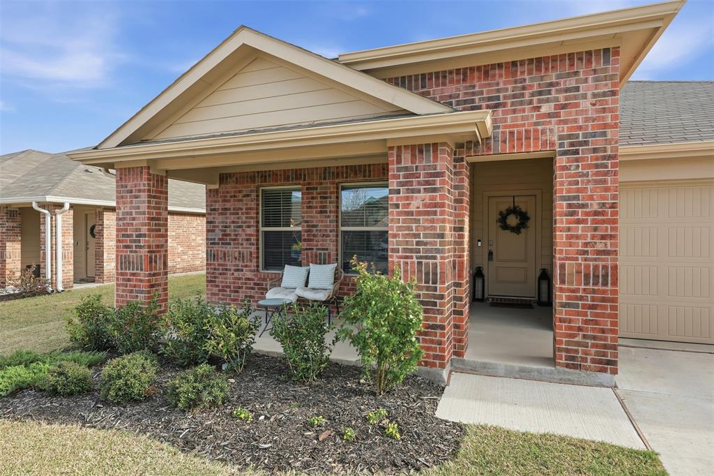 613 Whitecomb Lane Justin, TX 76247 - Photo 27 of 39 a front view of a house with garden