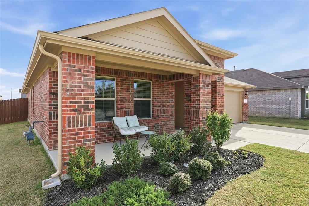 613 Whitecomb Lane Justin, TX 76247 - Photo 28 of 39 a front view of a house with garden