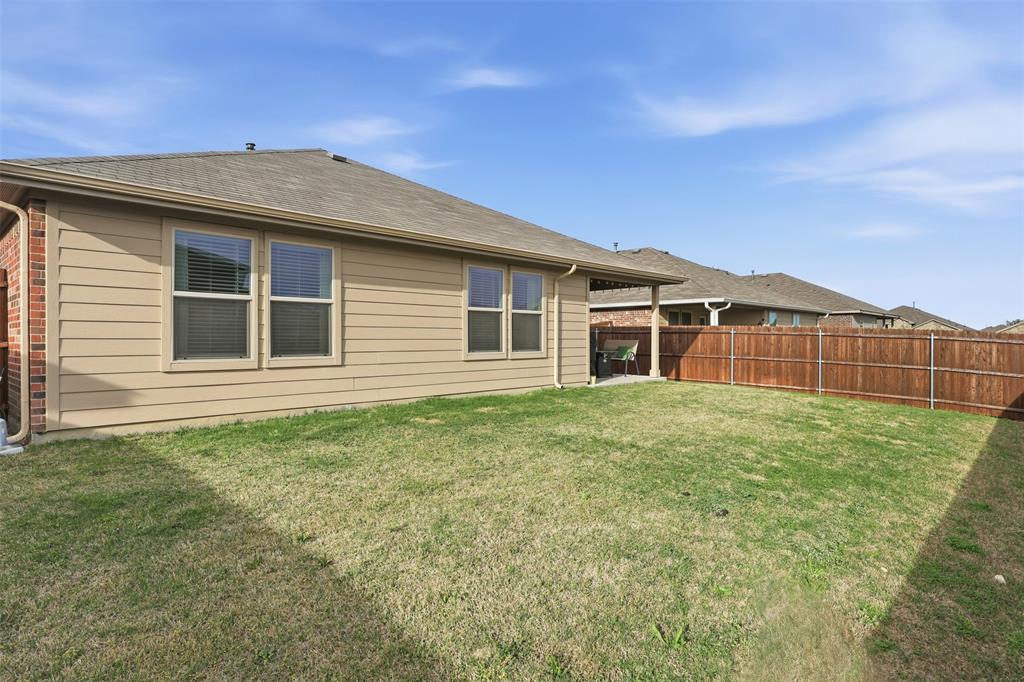 613 Whitecomb Lane Justin, TX 76247 - Photo 31 of 39 a house view with a garden space