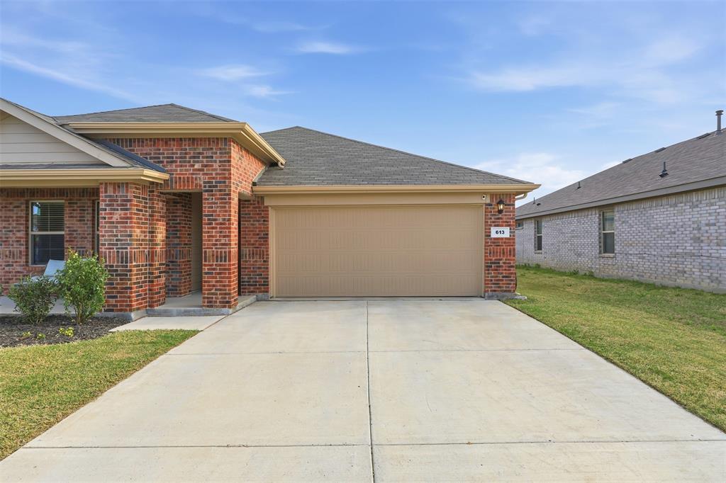 613 Whitecomb Lane Justin, TX 76247 - Photo 33 of 39 a front view of house with yard