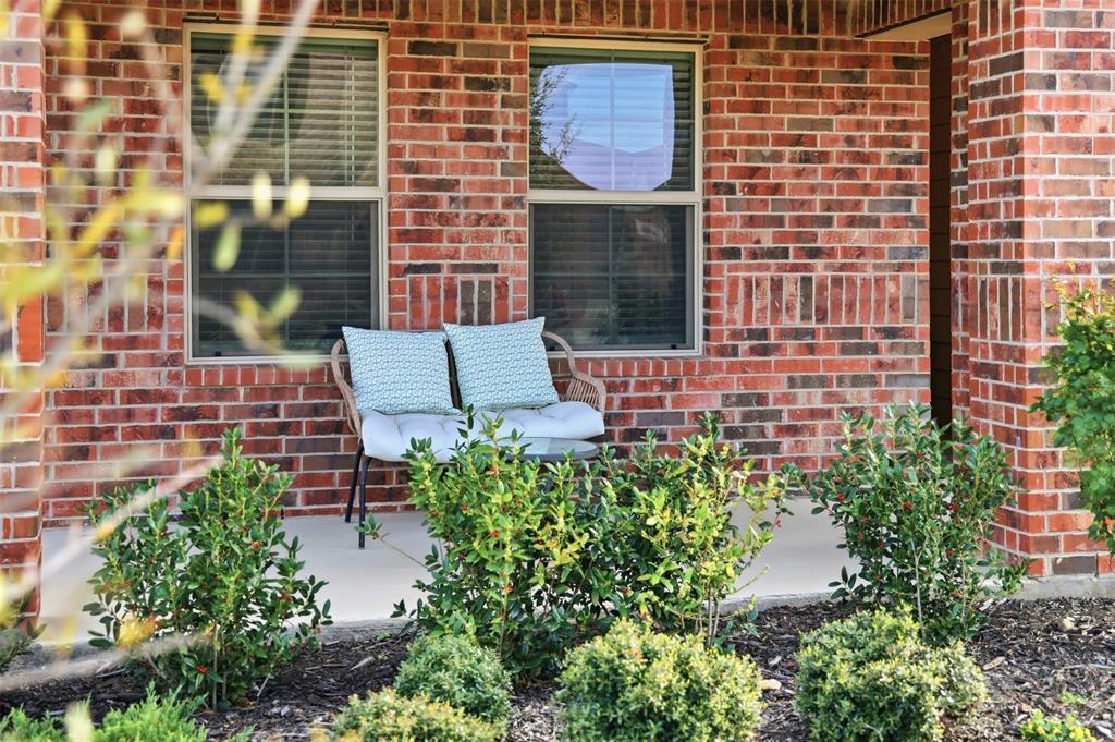 613 Whitecomb Lane Justin, TX 76247 - Photo 35 of 39 front view of a brick building with a yard