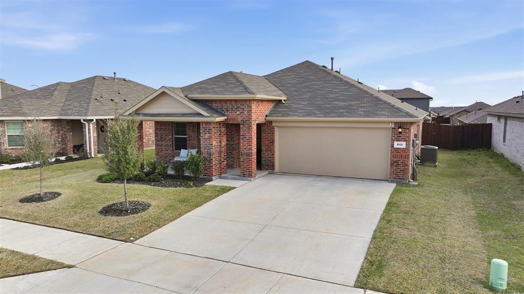 613 Whitecomb Lane Justin, TX 76247 - Photo 36 of 39 front view of a house with yard