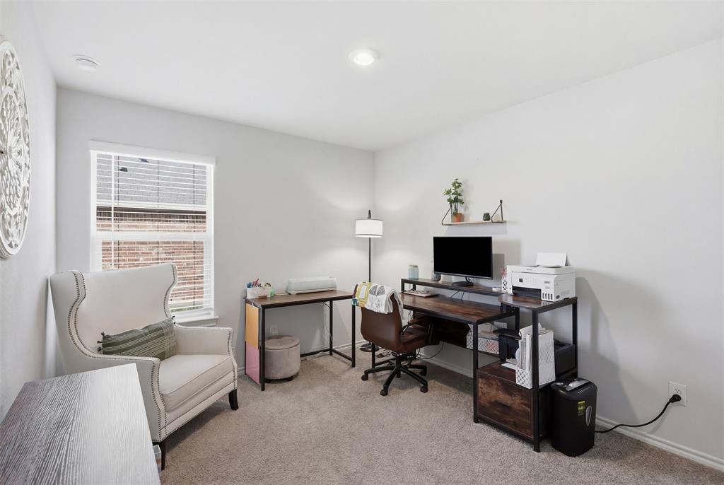 613 Whitecomb Lane Justin, TX 76247 - Photo 8 of 39 a view of a workspace with furniture and a window