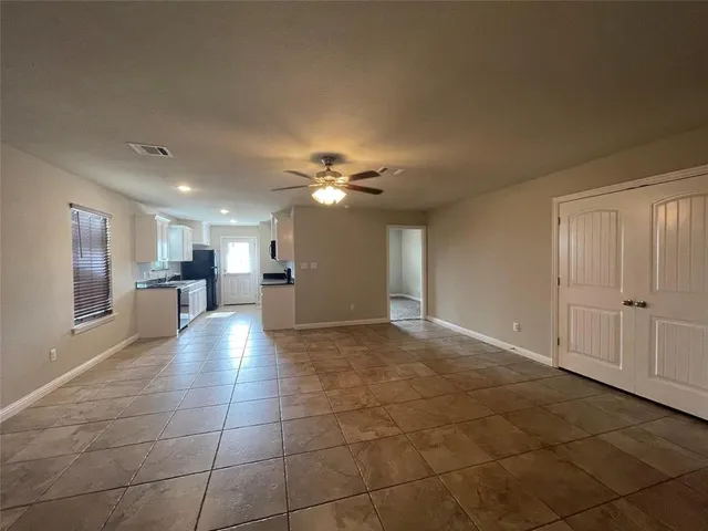a view of a kitchen with a sink and a chandelier