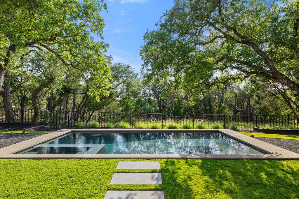7516 Davenport Divide Road Austin, TX 78738 - Photo 3 of 40 This home captures the essence of Hill Country living with a sparkling pool and spa and custom landscaping.