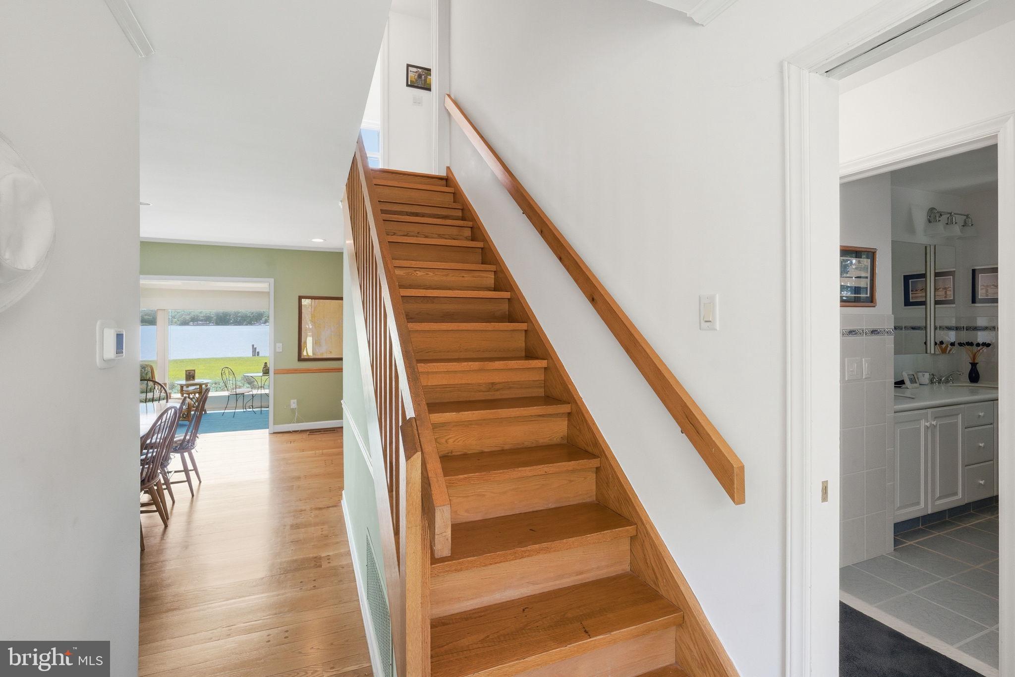 202 Royston Shores Road Chestertown, MD 21620 - Photo 7 of 72 Inviting staircase leads to serene spaces.