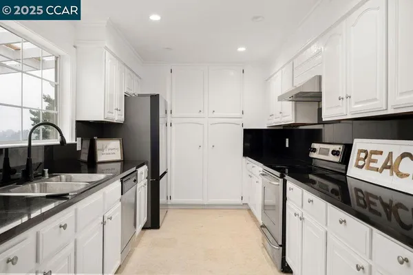 a room with furniture a washer and dryer
