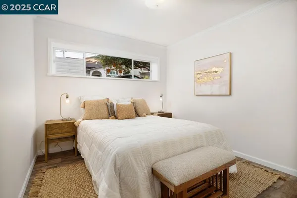 a bedroom with furniture and a window