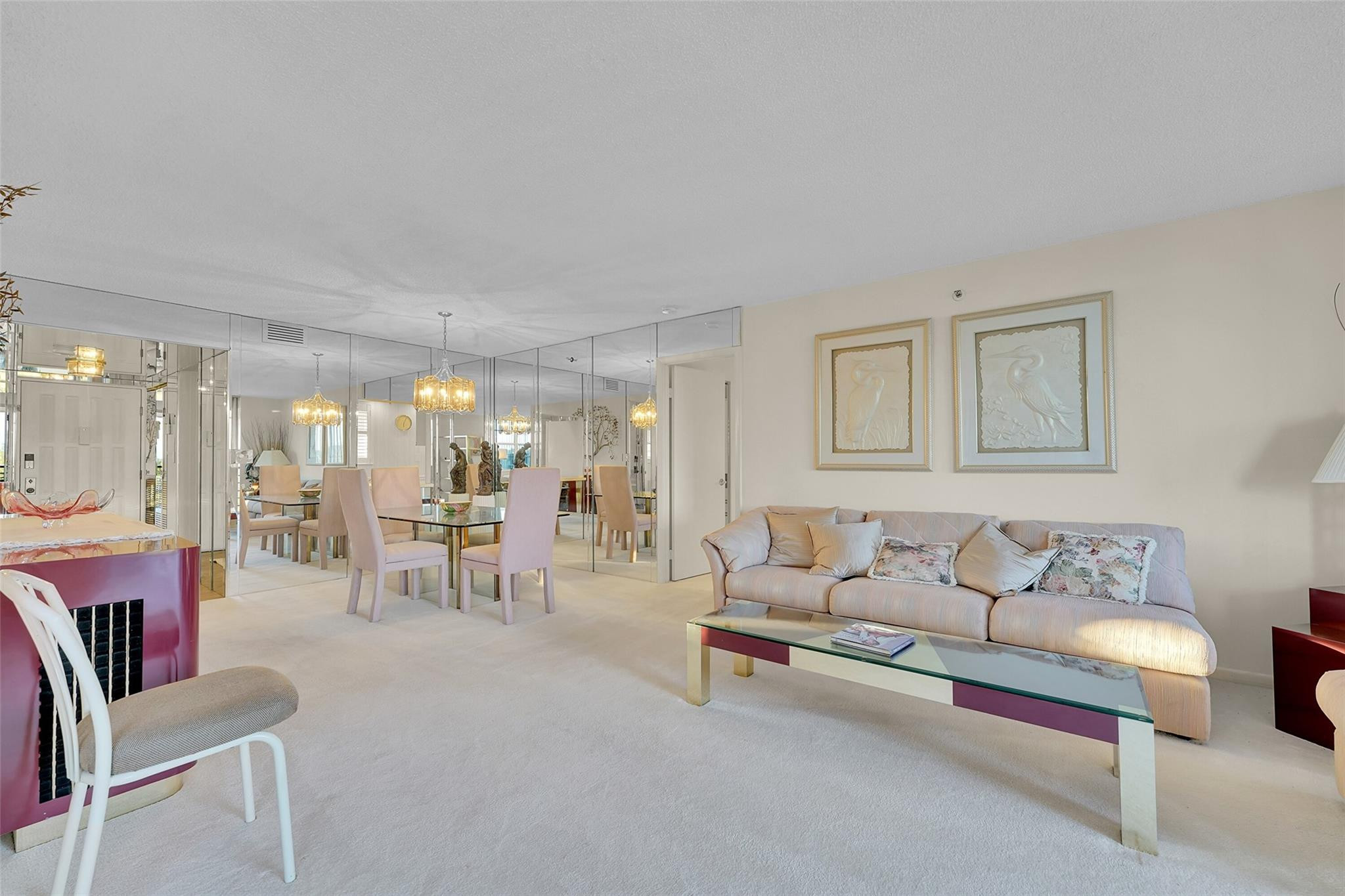 5340 Northwest 2nd Avenue, Unit PH26 Boca Raton, FL 33487 - Photo 22 of 53 a living room with furniture and a table