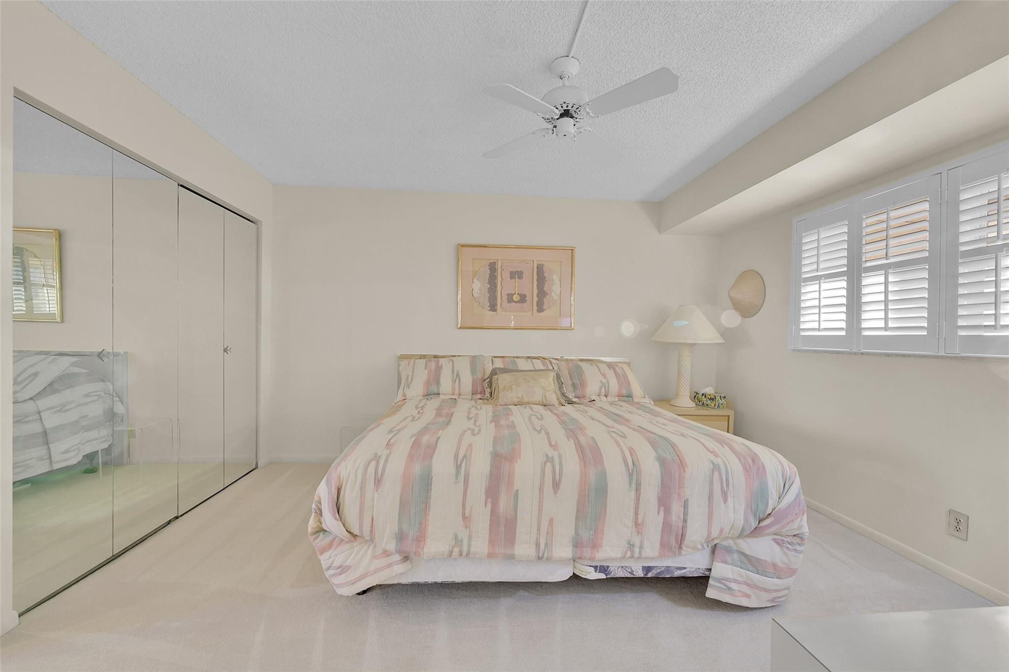 5340 Northwest 2nd Avenue, Unit PH26 Boca Raton, FL 33487 - Photo 28 of 53 a bedroom with a bed and a table