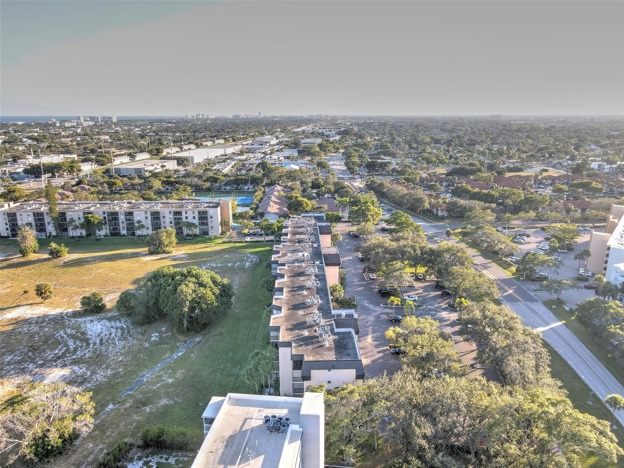 5340 Northwest 2nd Avenue, Unit PH26 Boca Raton, FL 33487 - Photo 3 of 53 an aerial view of a city with lots of residential buildings
