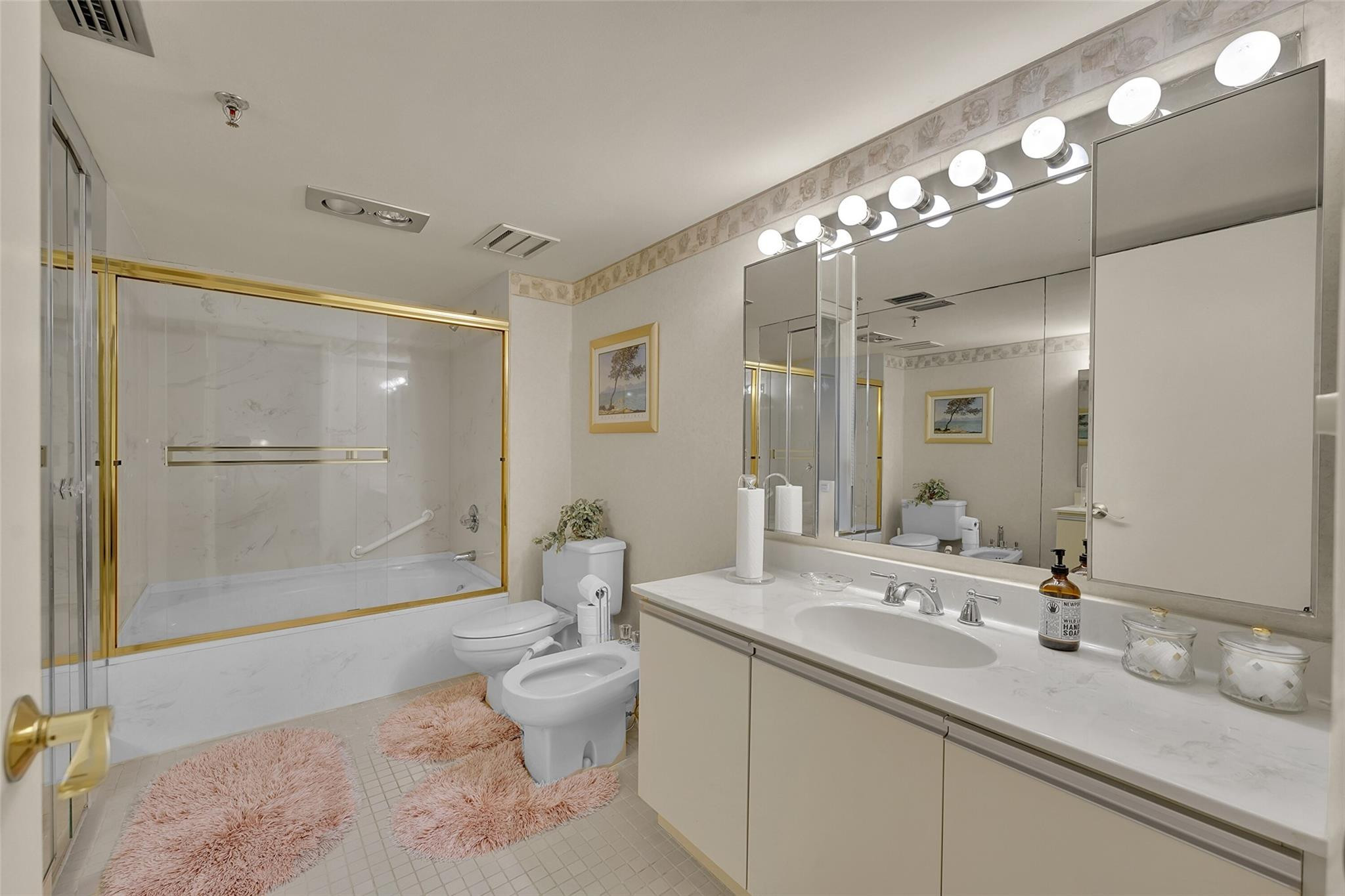 5340 Northwest 2nd Avenue, Unit PH26 Boca Raton, FL 33487 - Photo 32 of 53 a spacious bathroom with a granite countertop sink mirror and a shower
