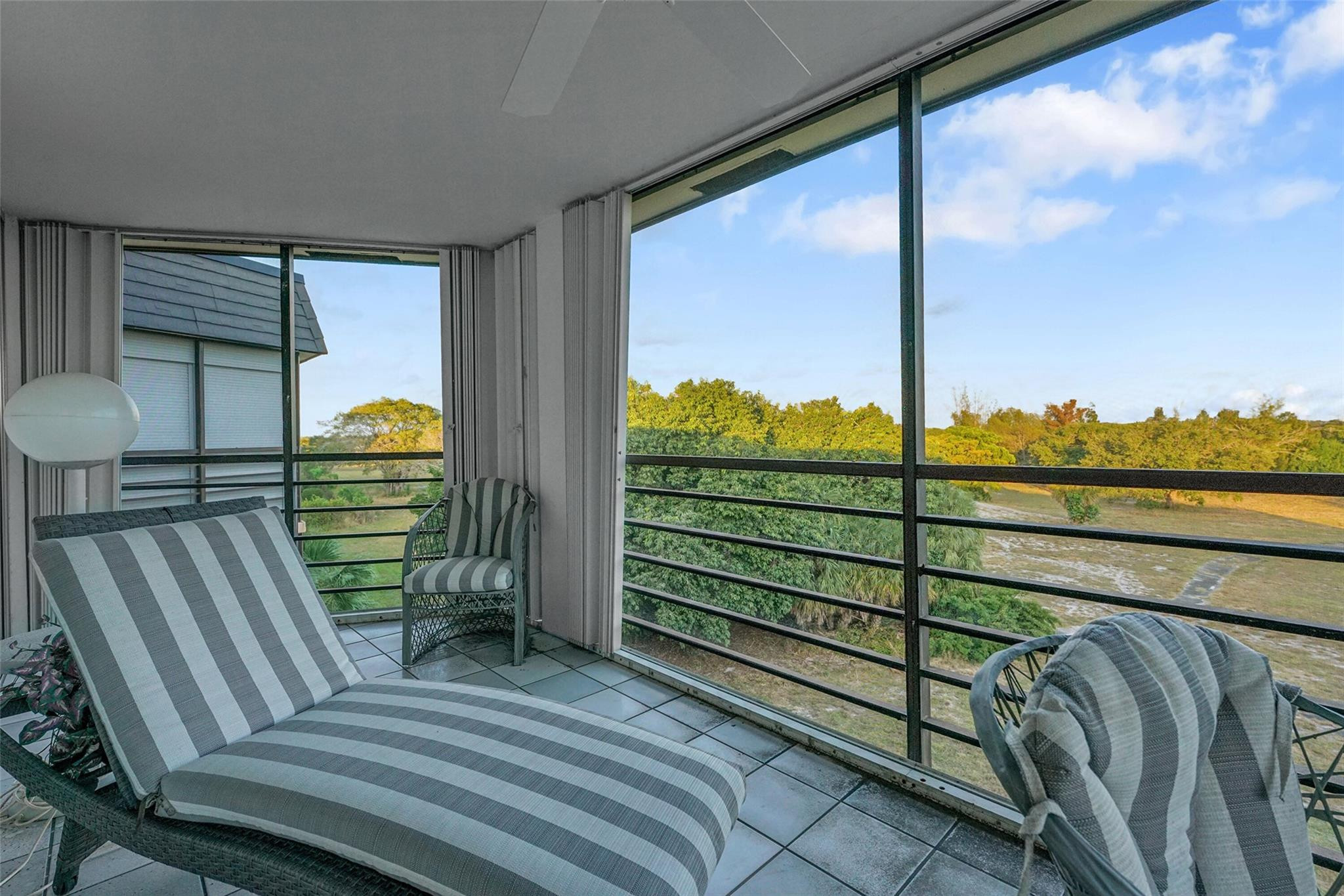 5340 Northwest 2nd Avenue, Unit PH26 Boca Raton, FL 33487 - Photo 9 of 53 a view of a balcony with chairs
