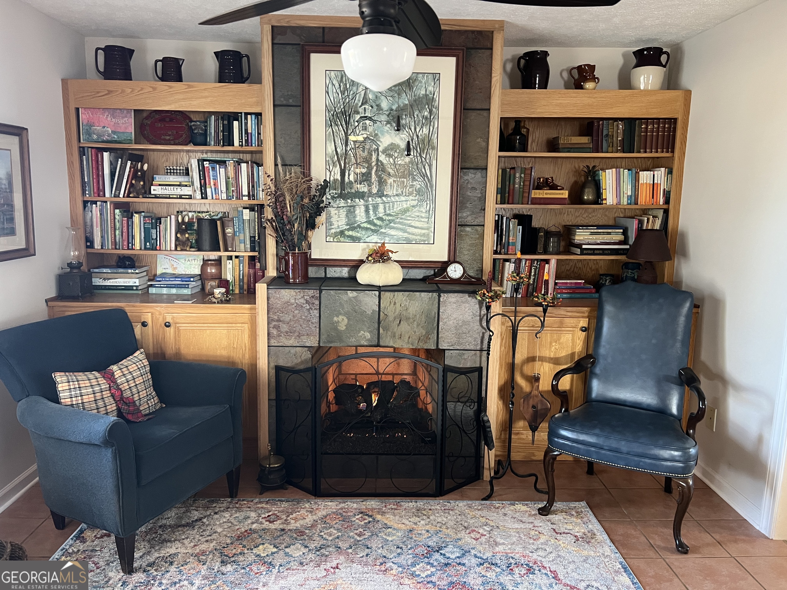 1512 Buckeye Road East Dublin, GA 31027 - Photo 15 of 45 a living room with furniture and a book shelf