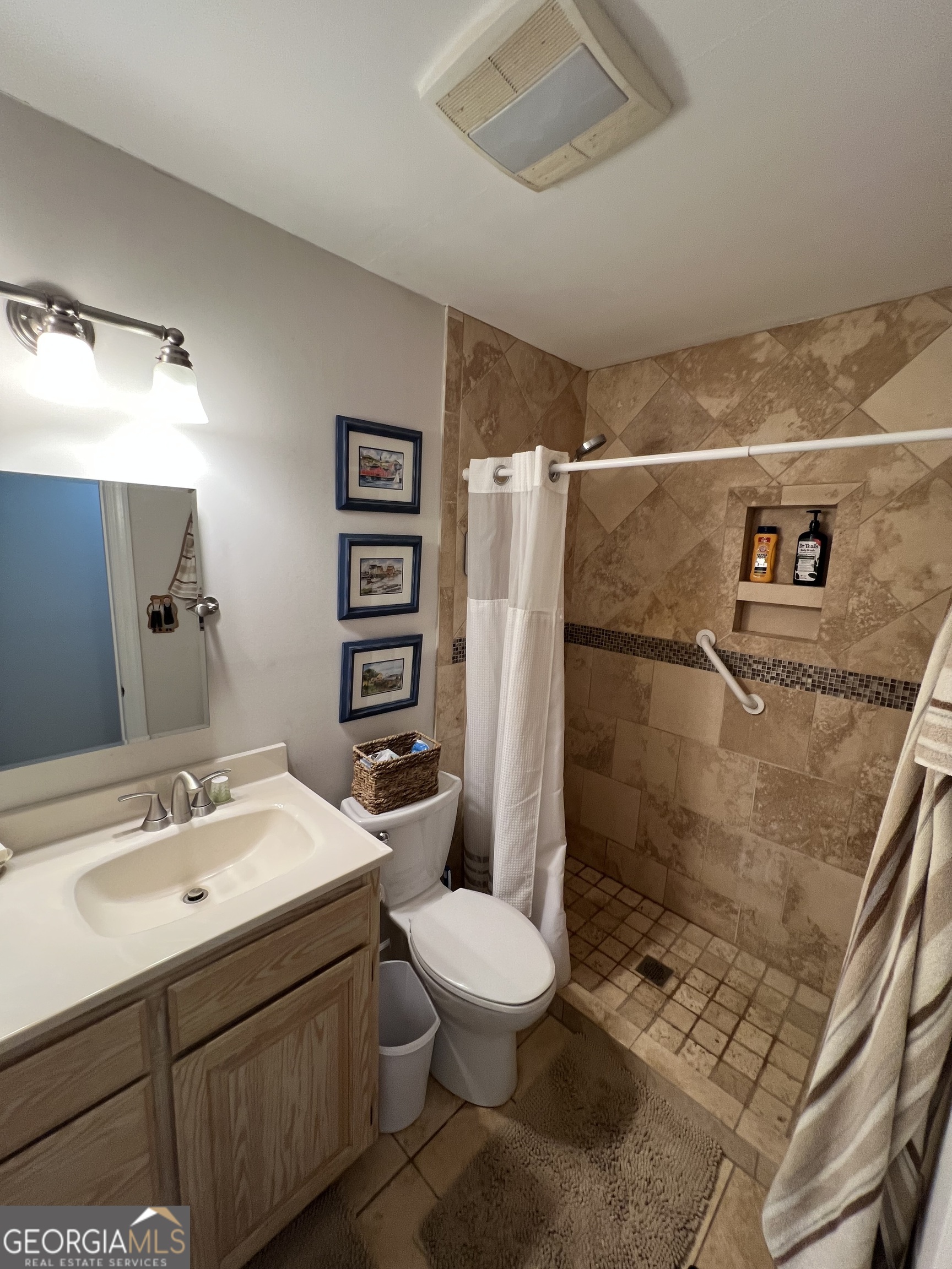 1512 Buckeye Road East Dublin, GA 31027 - Photo 18 of 45 a bathroom with a sink toilet and shower