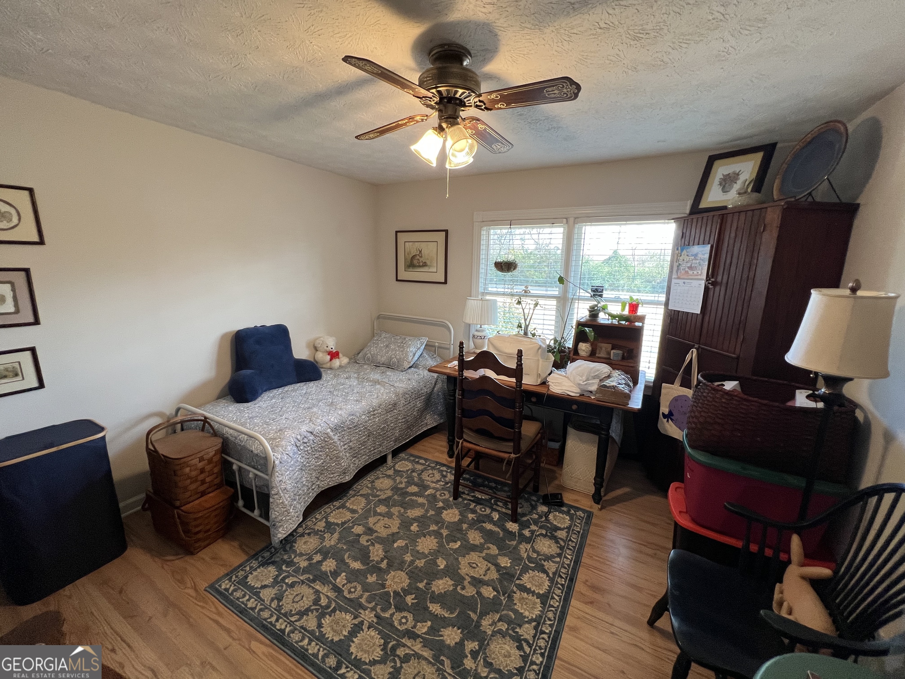 1512 Buckeye Road East Dublin, GA 31027 - Photo 20 of 45 a living room with furniture a table and a large window