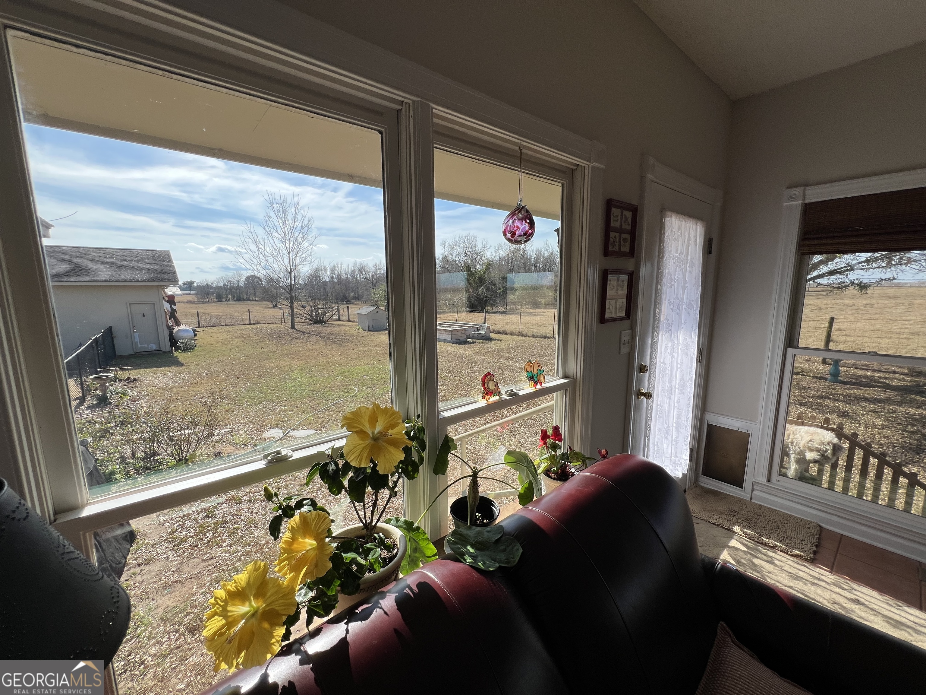 1512 Buckeye Road East Dublin, GA 31027 - Photo 29 of 45 a living room with furniture and a floor to ceiling window