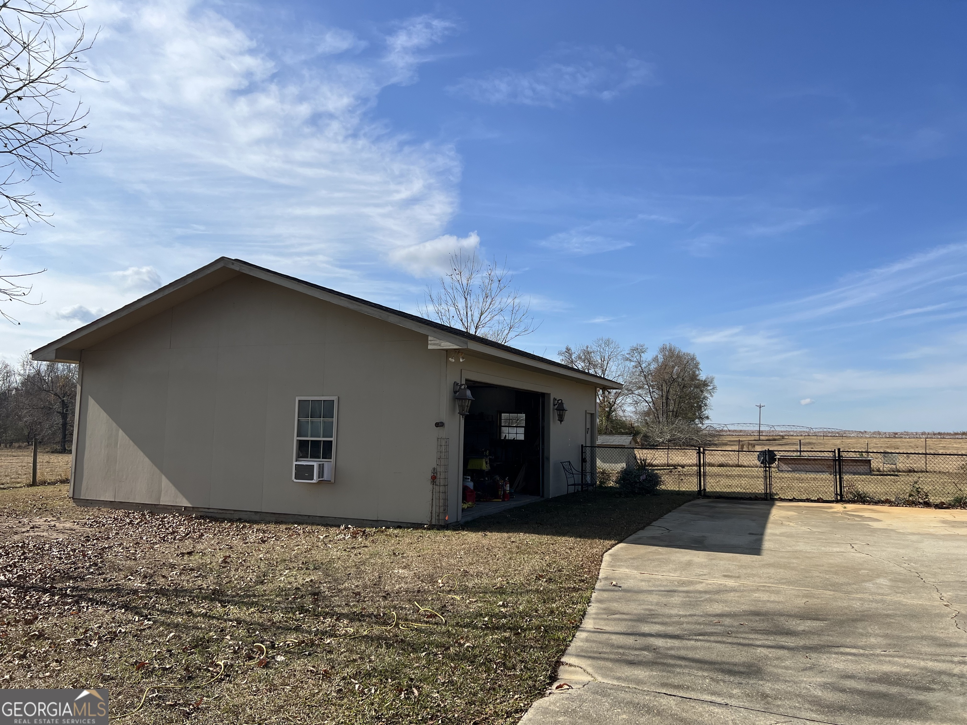 1512 Buckeye Road East Dublin, GA 31027 - Photo 30 of 45 a backyard of a house with wooden fence