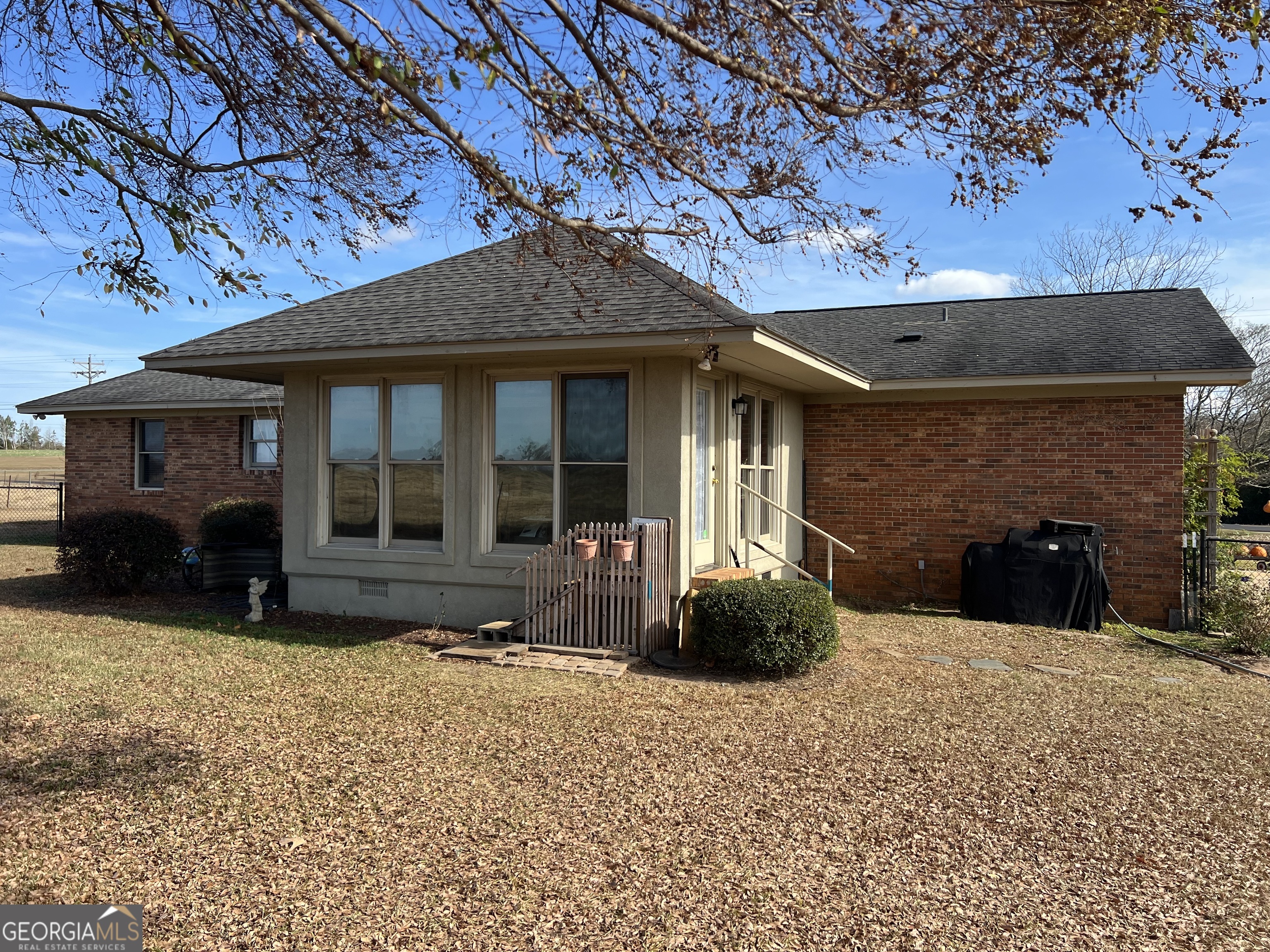 1512 Buckeye Road East Dublin, GA 31027 - Photo 35 of 45 a view of a house with a yard and large tree