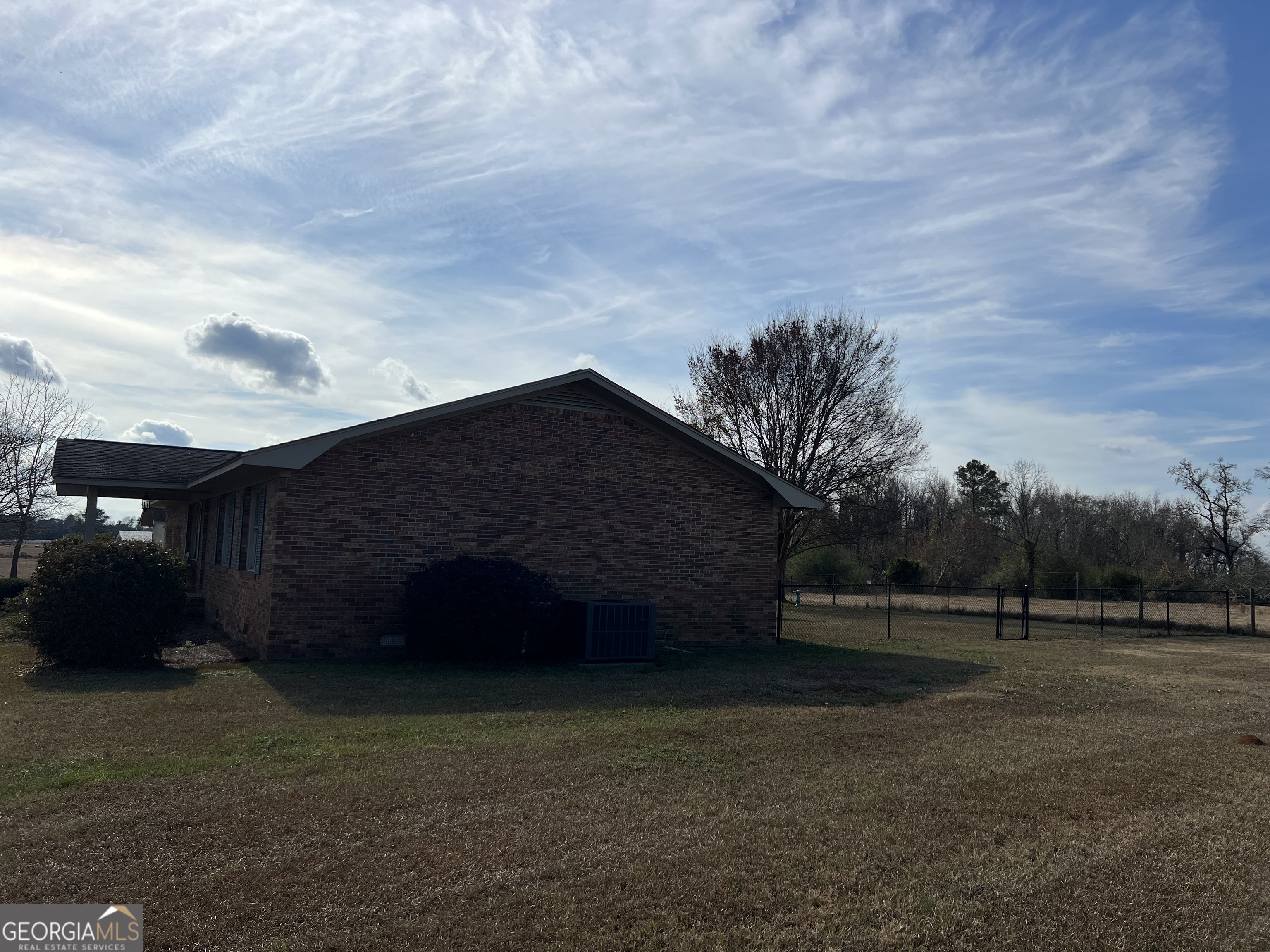 1512 Buckeye Road East Dublin, GA 31027 - Photo 38 of 45 a backyard of a house with lots of green space