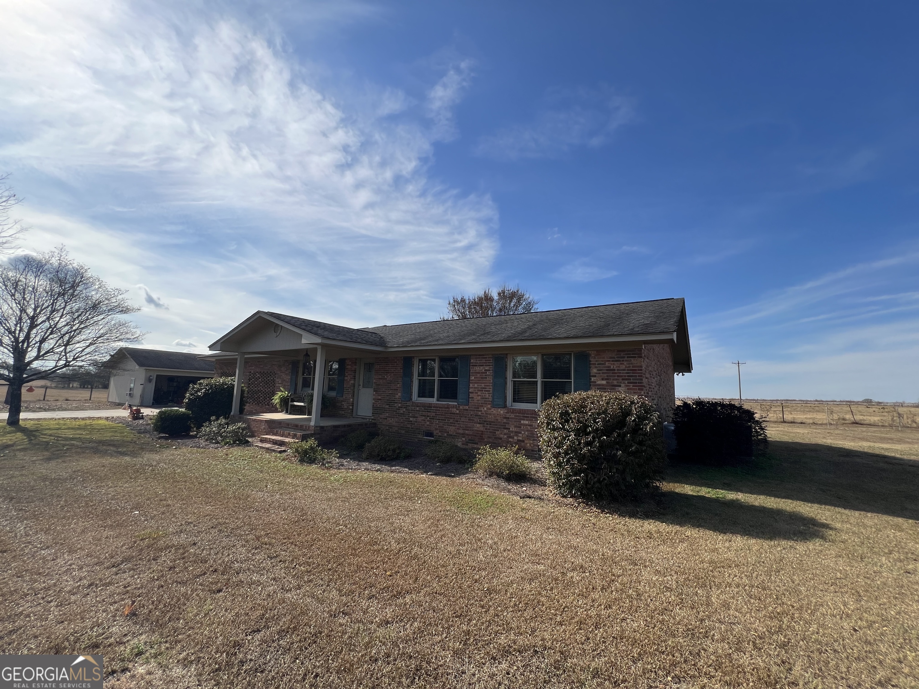 1512 Buckeye Road East Dublin, GA 31027 - Photo 39 of 45 a front view of house with yard and car parked