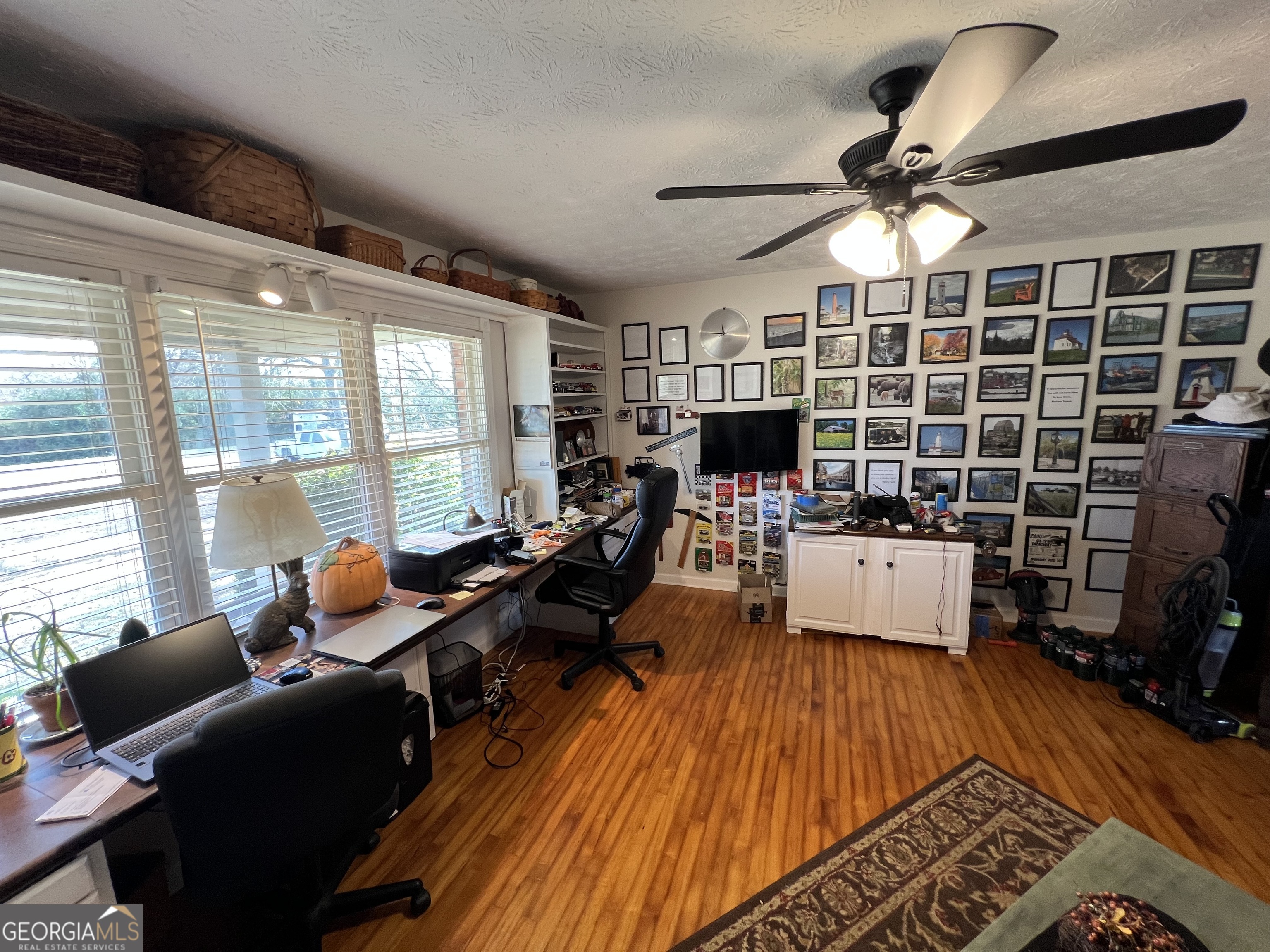 1512 Buckeye Road East Dublin, GA 31027 - Photo 10 of 45 a living room with furniture a rug and a flat screen tv