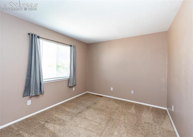 995 Winebrook Way Fountain, CO 80817 - Photo 32 of 44 View of carpeted bedroom