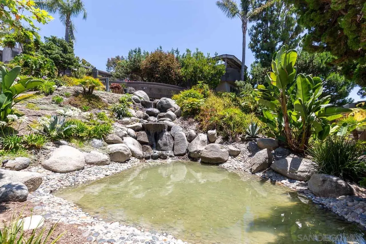 155 Rosebay Drive, Unit 28 Encinitas, CA 92024 - Photo 13 of 23 a view of a swimming pool with some trees
