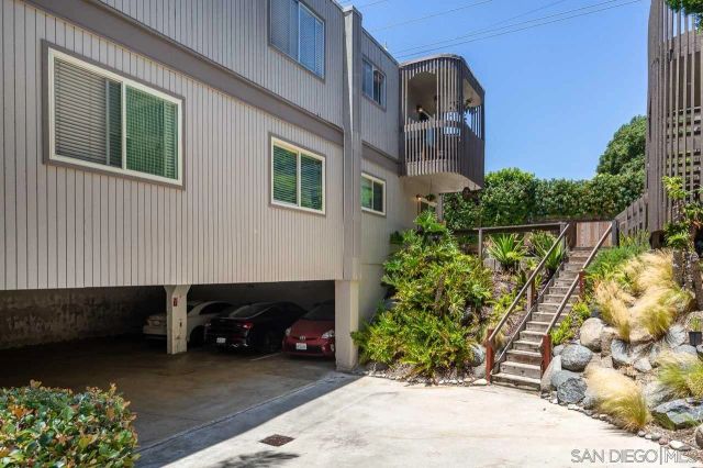 a couple of potted plants in front of a building