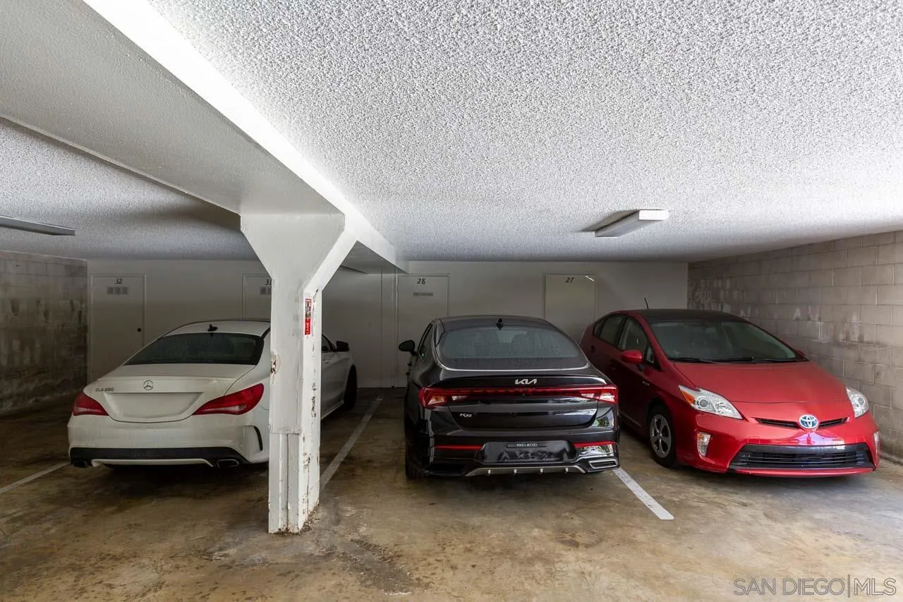 155 Rosebay Drive, Unit 28 Encinitas, CA 92024 - Photo 17 of 23 a view of parking garage with cars parked