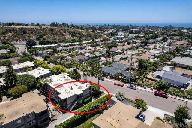 an aerial view of a city with lots of residential buildings