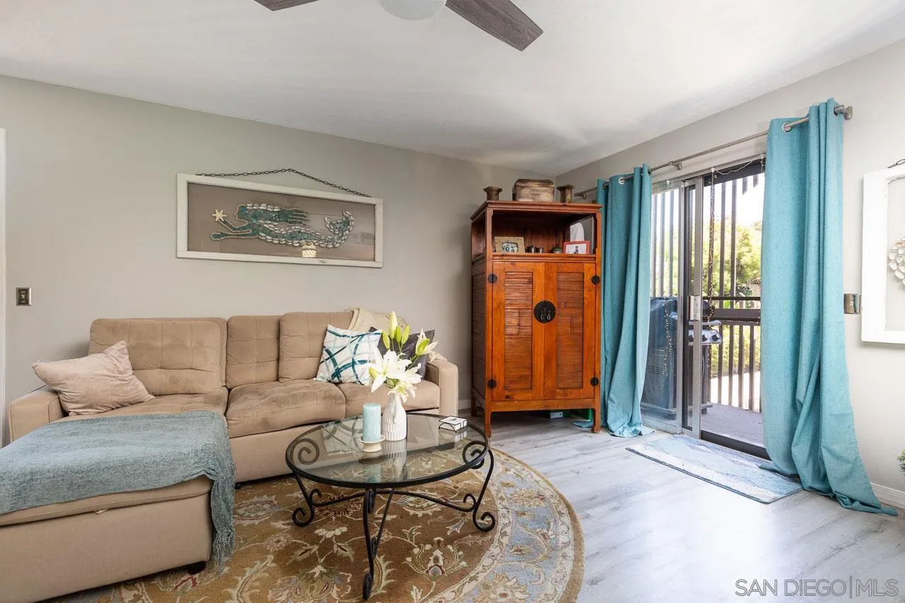 155 Rosebay Drive, Unit 28 Encinitas, CA 92024 - Photo 3 of 23 a living room with furniture and wooden floor