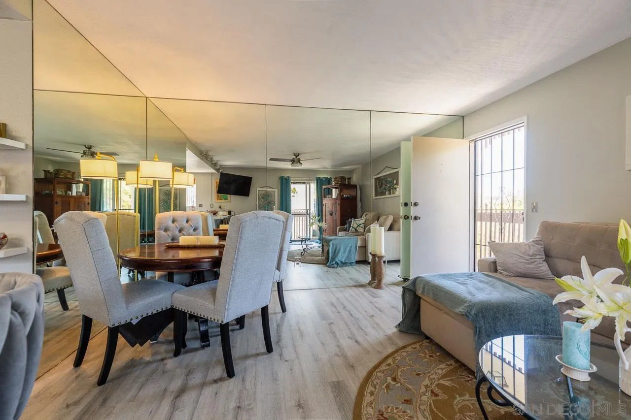 155 Rosebay Drive, Unit 28 Encinitas, CA 92024 - Photo 4 of 23 a view of a dining room with furniture window and wooden floor