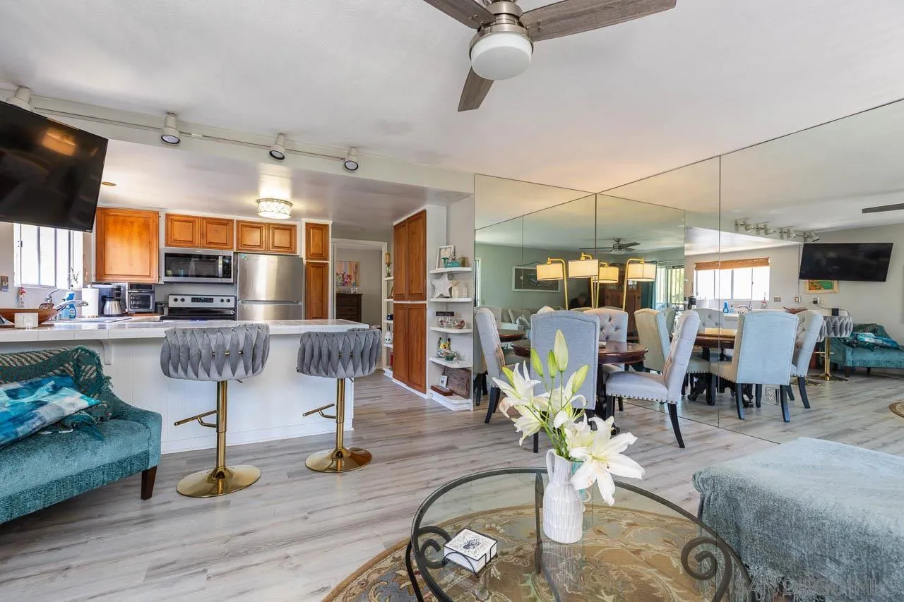 155 Rosebay Drive, Unit 28 Encinitas, CA 92024 - Photo 5 of 23 a living room with lots of furniture and kitchen view