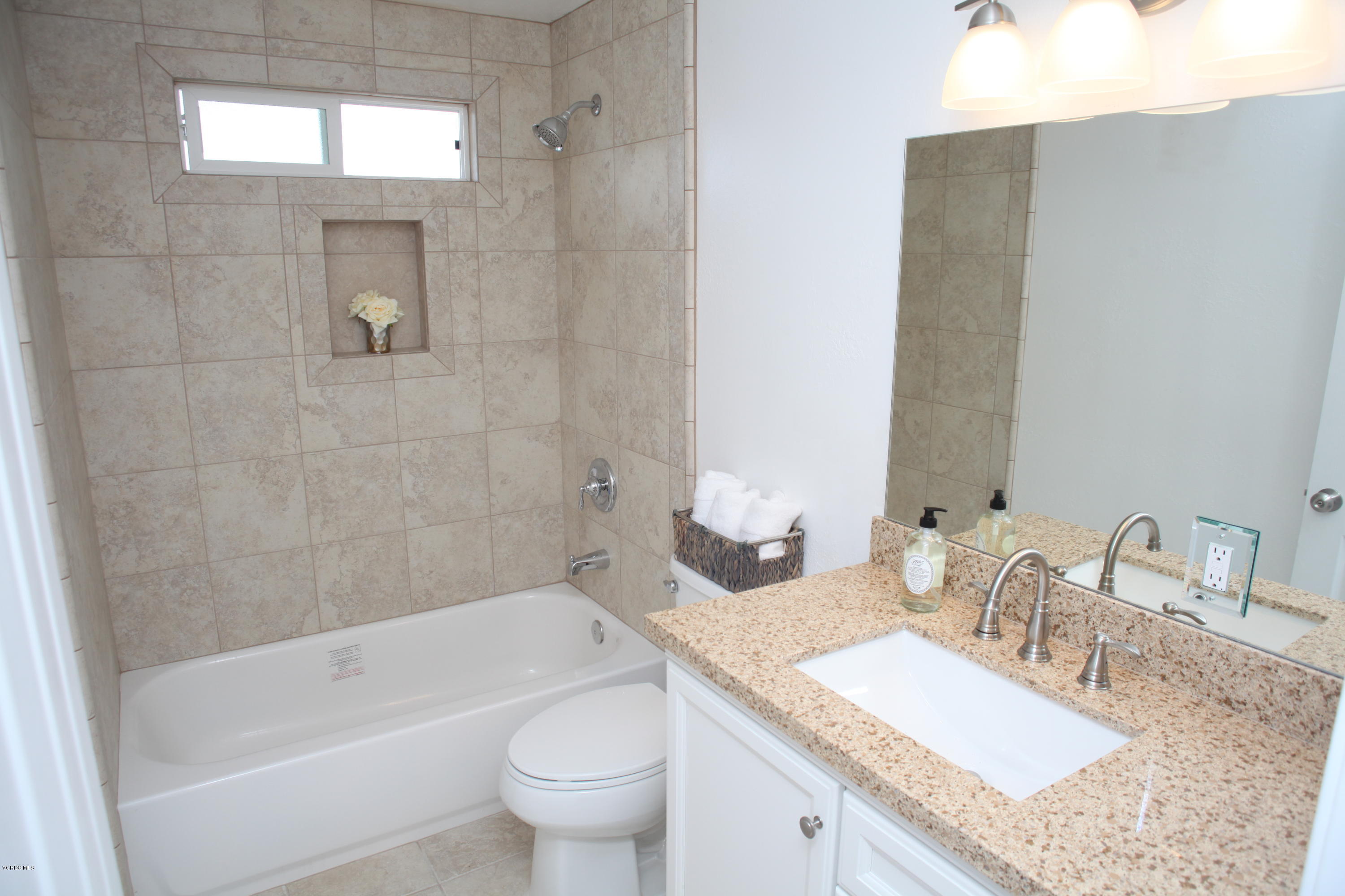 2061 Rhoda Street Simi Valley, CA 93065 - Photo 16 of 27 a bathroom with a granite countertop bathtub sink vanity mirror and toilet
