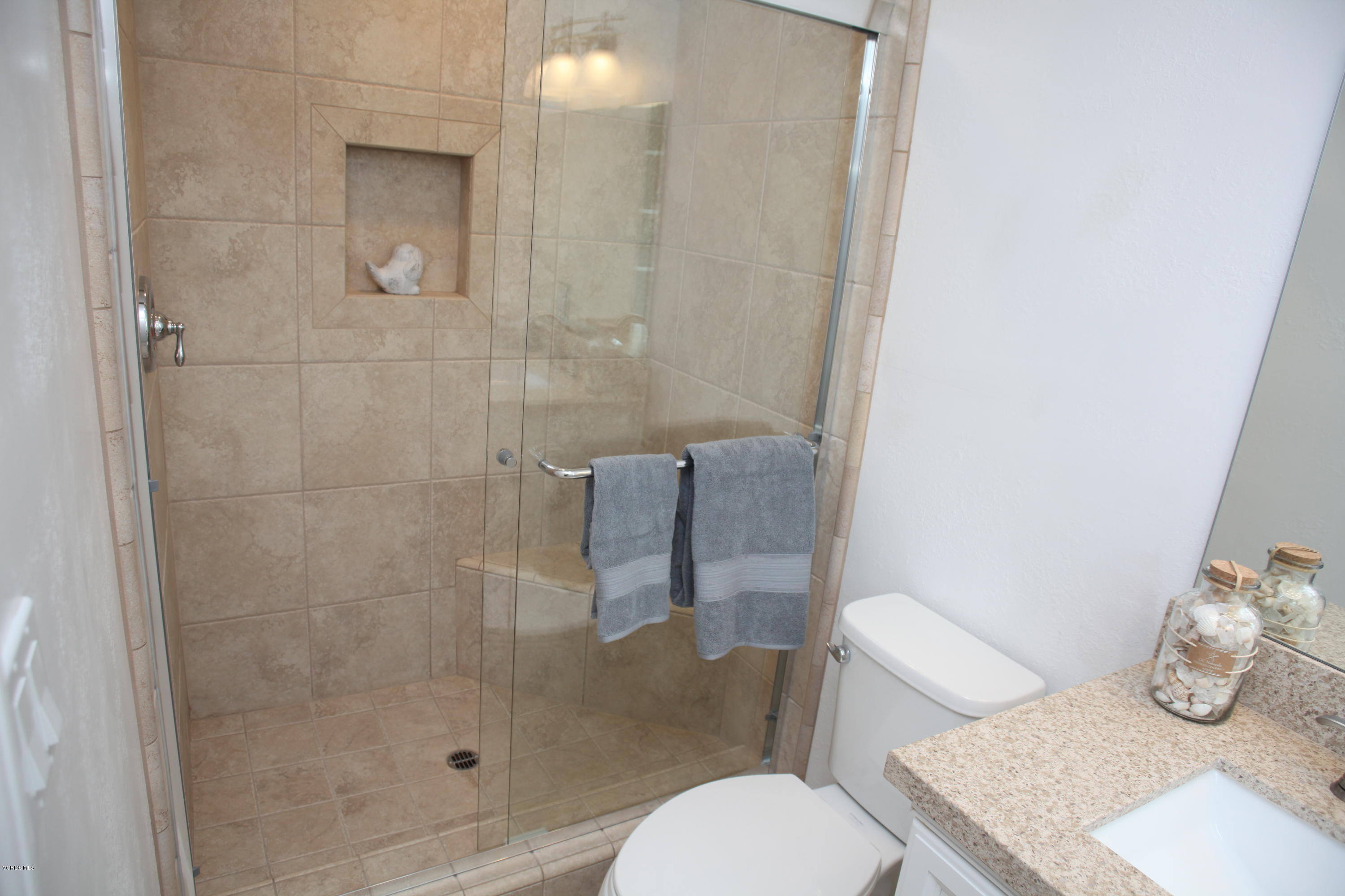 2061 Rhoda Street Simi Valley, CA 93065 - Photo 21 of 27 a bathroom with a toilet and a shower